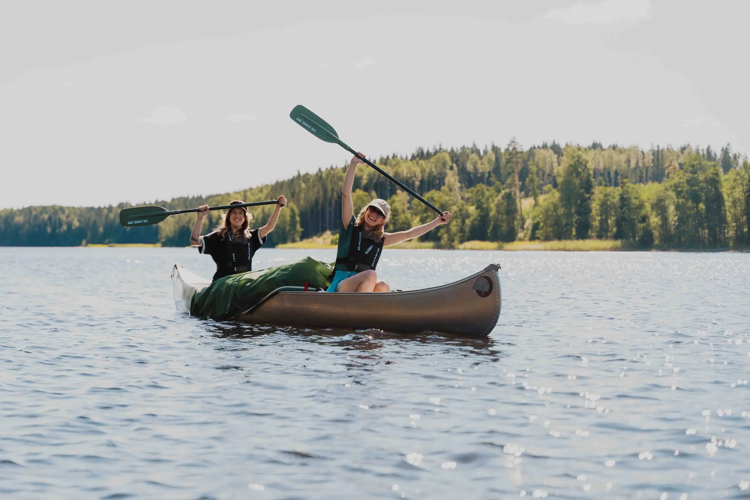 Two girls in Sweden doing The Canoe Trip