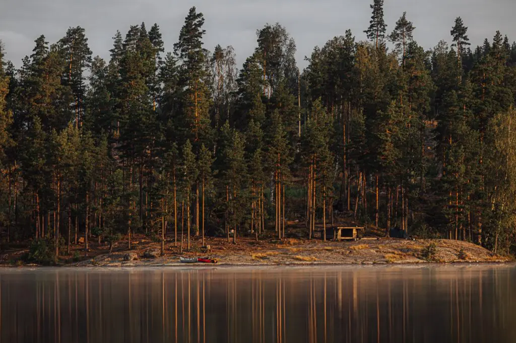 shelter by lake with canoes